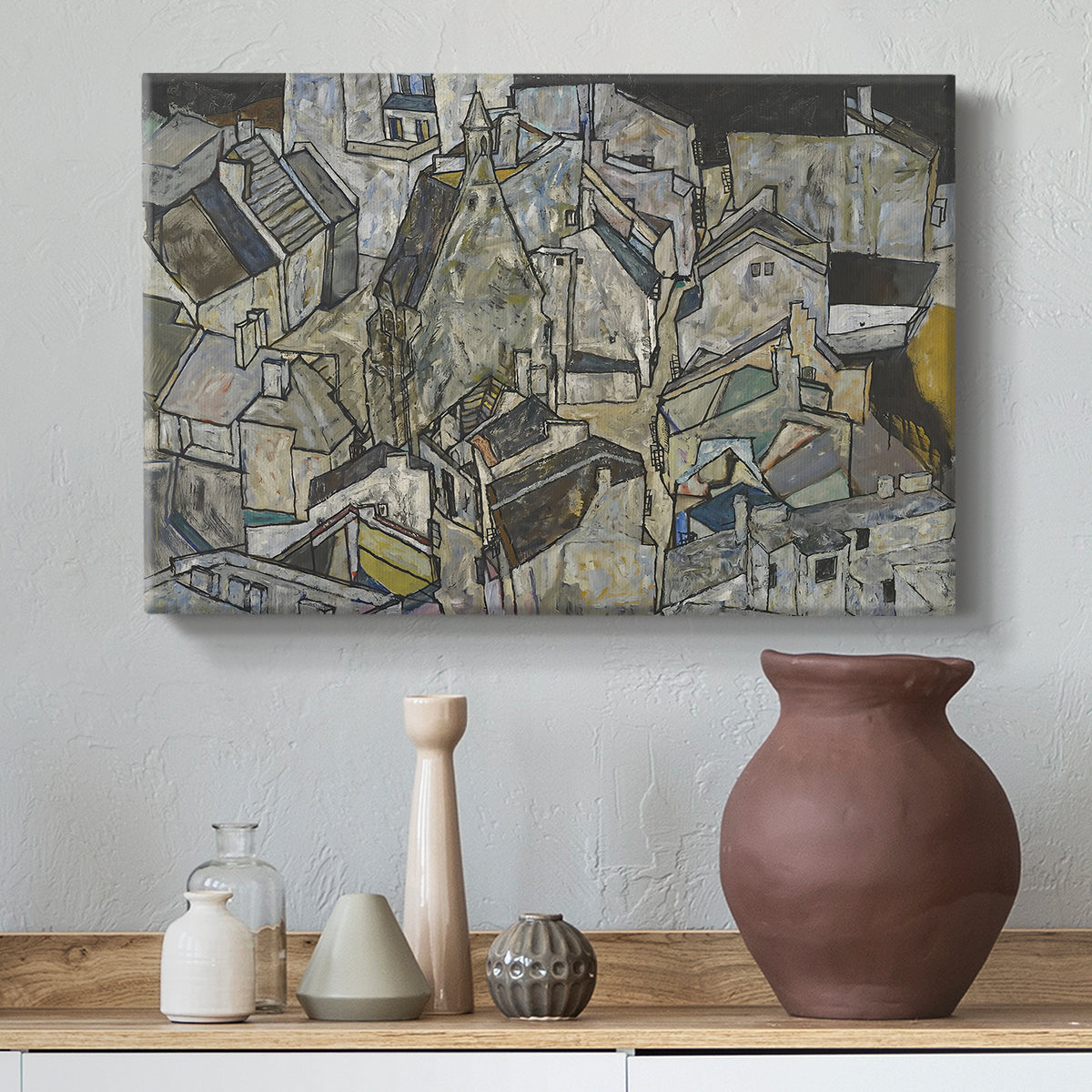 Canvas art print featuring an abstracted town view with angular rooftops and fragmented forms, styled above a decorative console