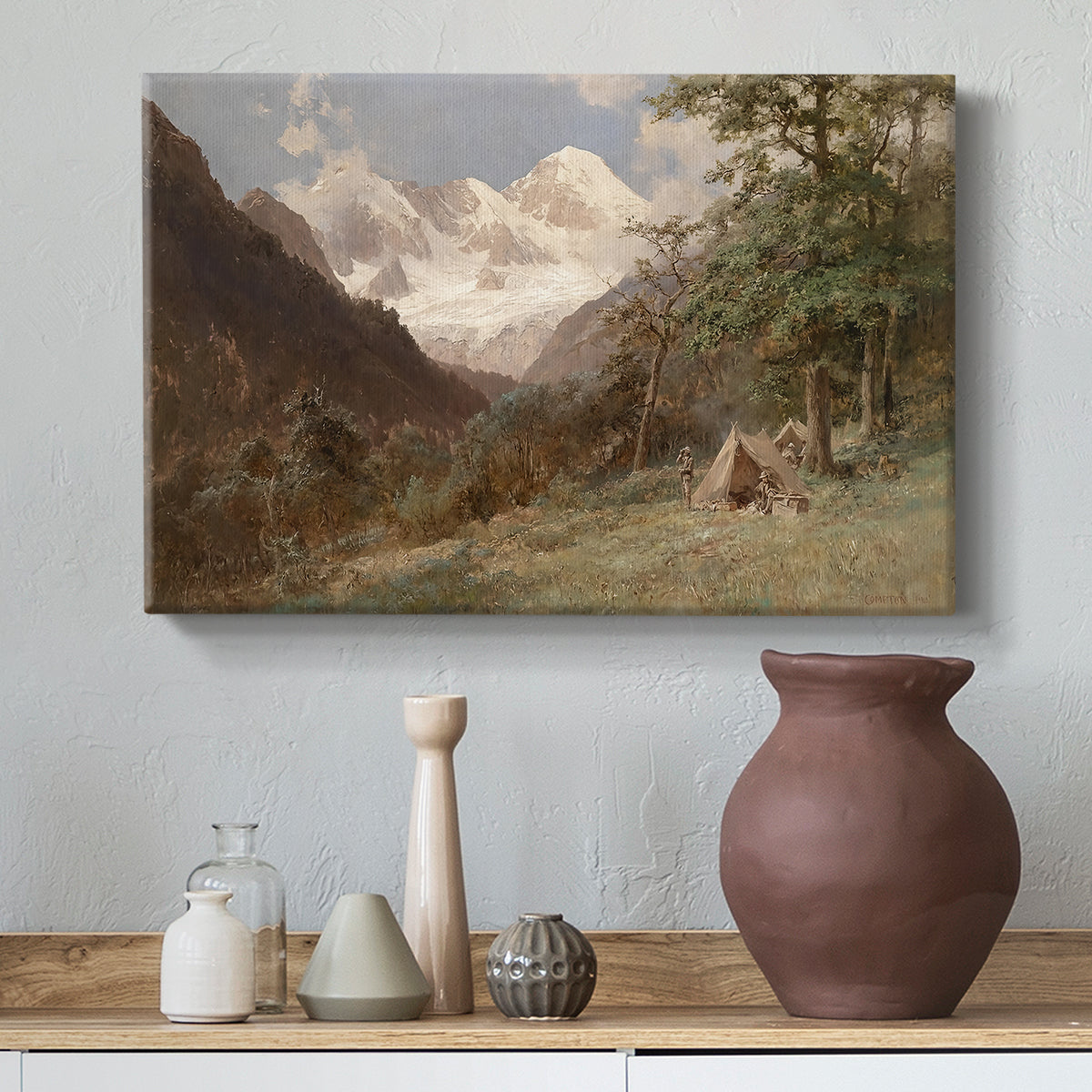 Canvas art print featuring a natural scene with valleys and rocky formations, styled above a decorative console