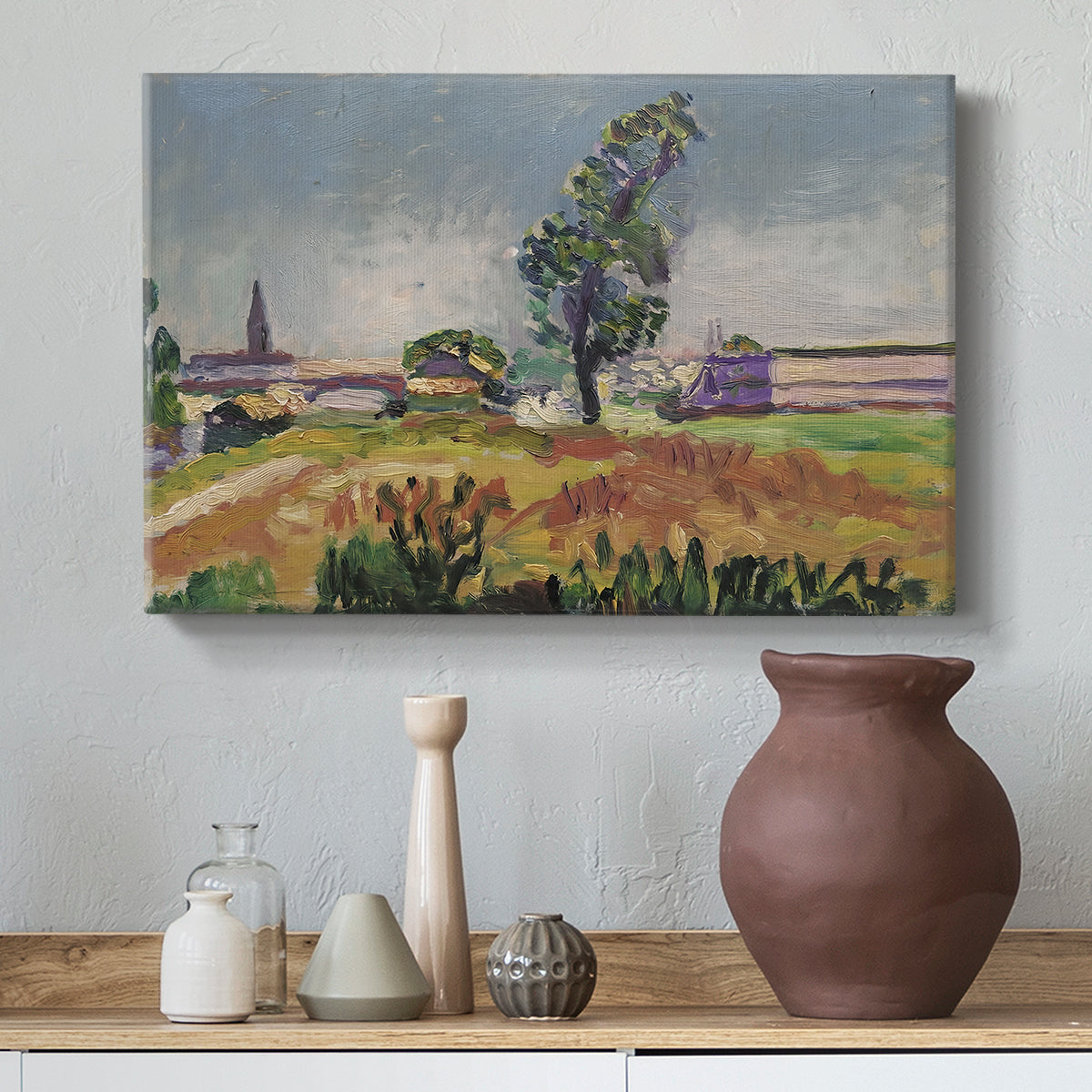 Canvas art print featuring a landscape with a river crossing and soft vegetation, styled above a decorative console