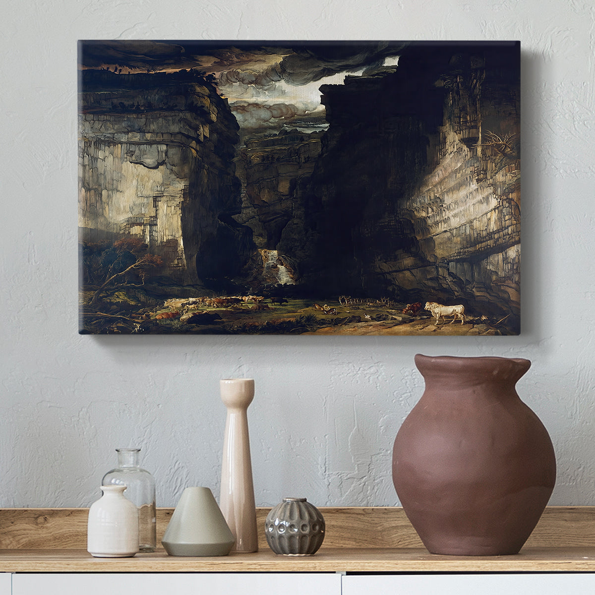Canvas art print featuring a natural scene featuring cliffs and cascading water, styled above a decorative console