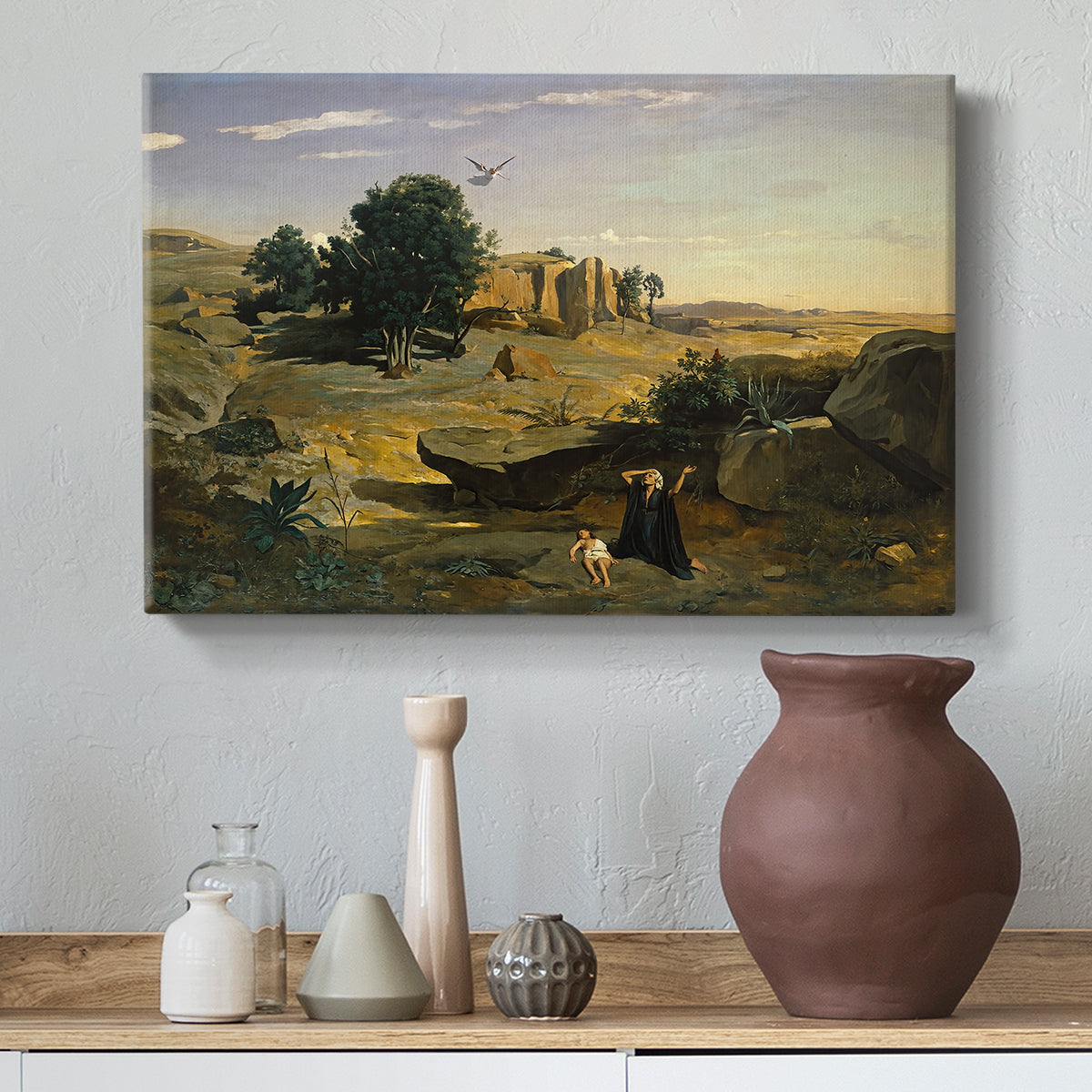 Canvas art print featuring an atmospheric landscape with lone figure and open space, styled above a decorative console