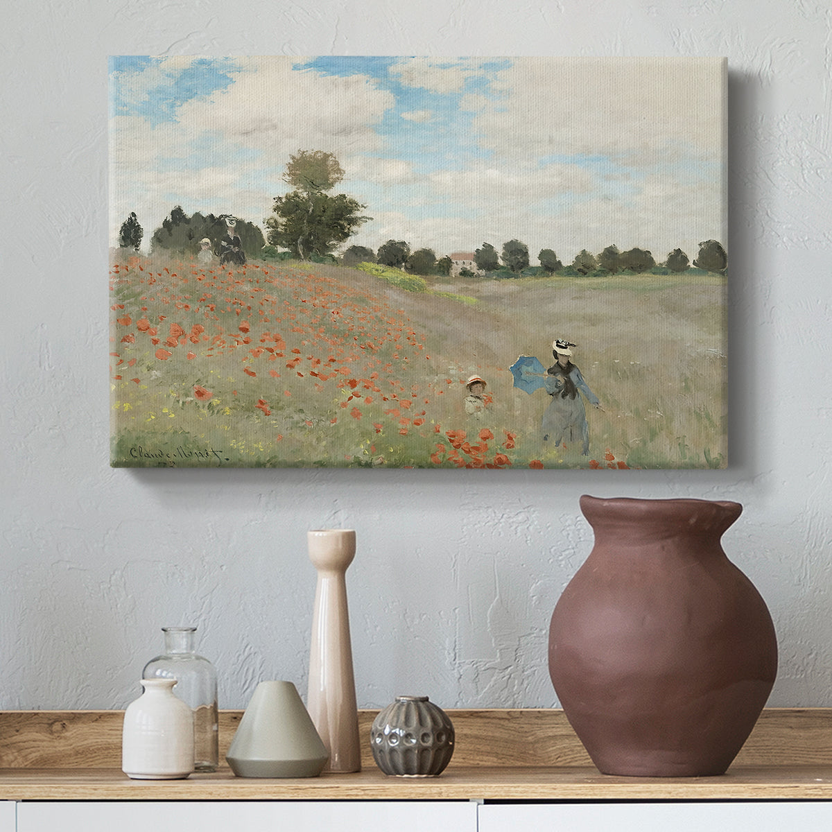 Canvas art print featuring a bright meadow filled with poppies under open sky, styled above a decorative console