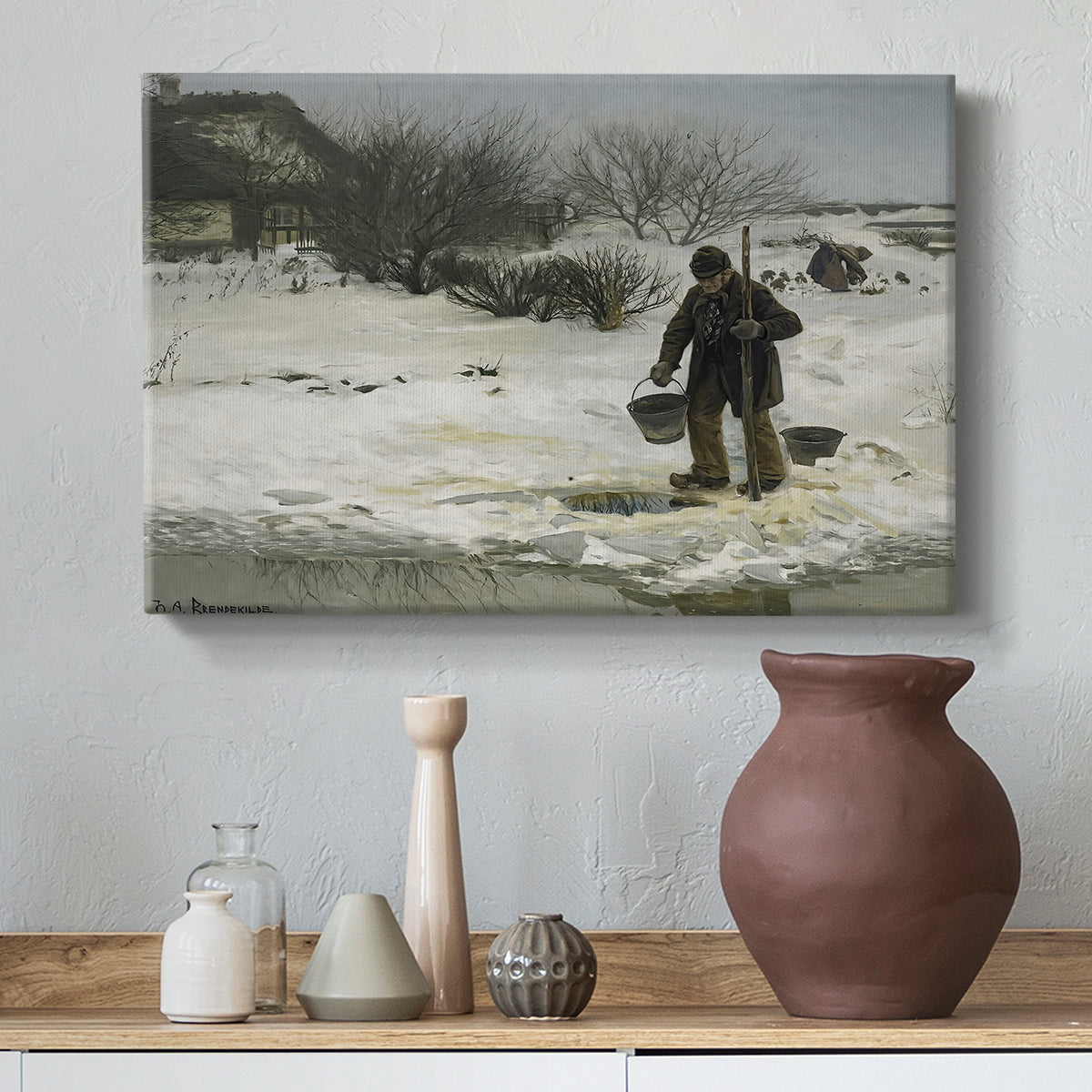 Canvas art print featuring a figures moving through open snowy terrain under gray sky, styled above a decorative console