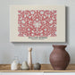 Canvas art print featuring a patterned surface with repeating floral clusters, styled above a decorative console