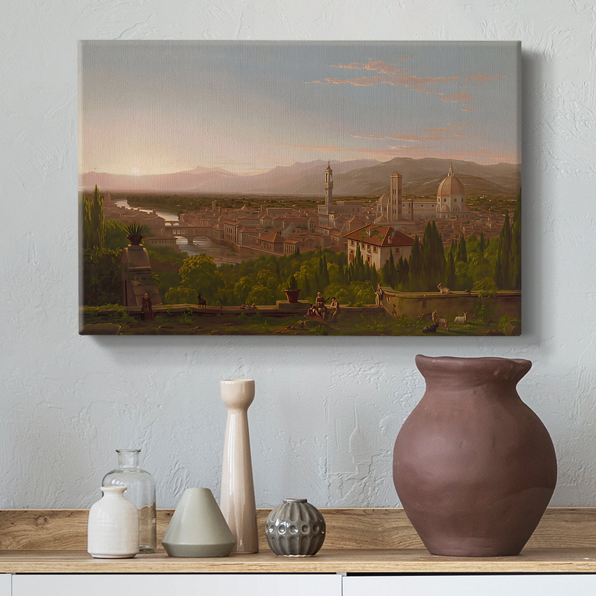 Canvas art print featuring a romantic cityscape integrated into natural terrain, styled above a decorative console