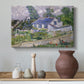 Canvas art print featuring a post-impressionist cityscape with rooftops and vegetation, styled above a decorative console