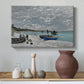 Canvas art print featuring a coastal landscape with sailboats and visitors on cliffside, styled above a decorative console