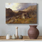 Canvas art print featuring a natural landscape with rolling terrain and distant peaks, styled above a decorative console