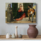 Canvas art print featuring a Renaissance image of mother and child flanked by saints, styled above a decorative console