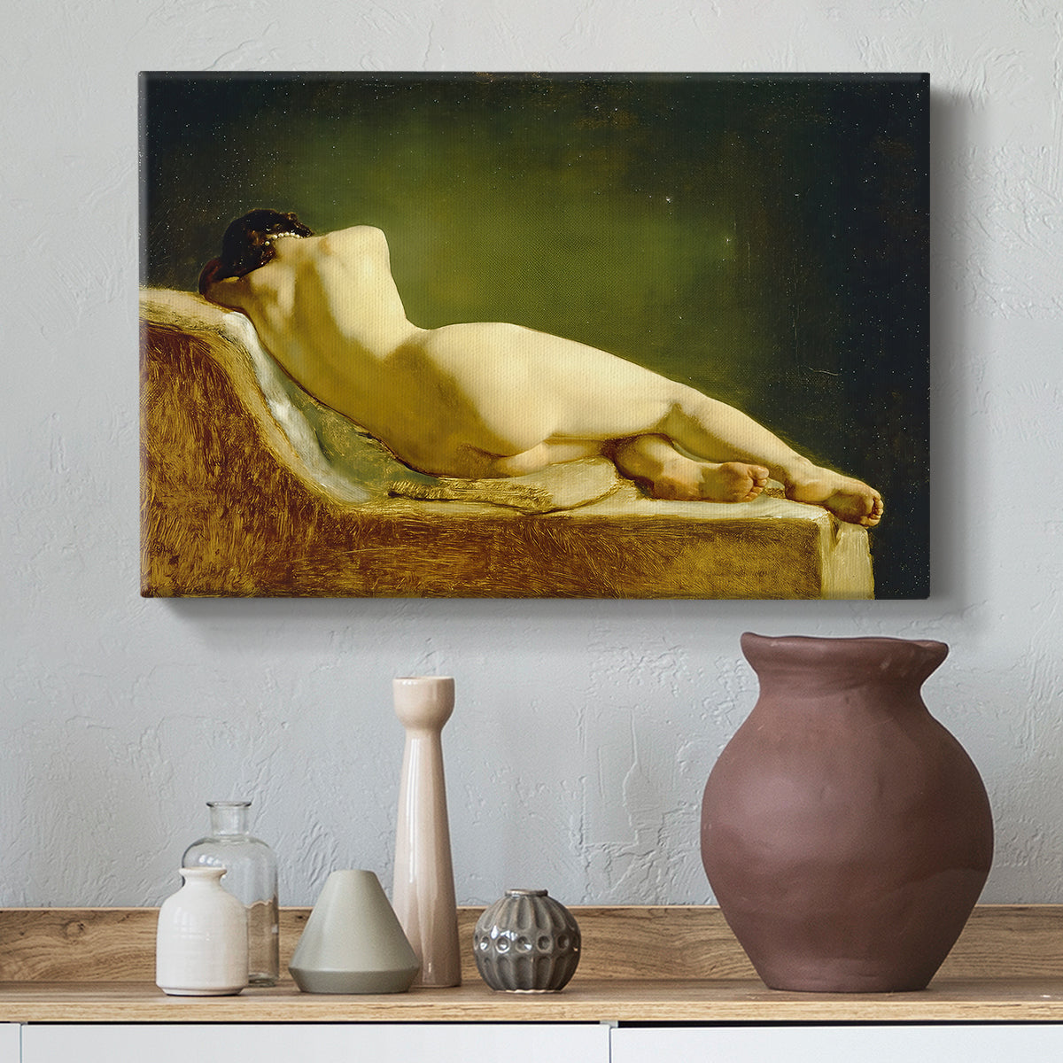 Canvas art print featuring a figure study of reclining body with soft lighting, styled above a decorative console