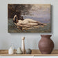 Canvas art print featuring a soft landscape with figure and sea in background, styled above a decorative console