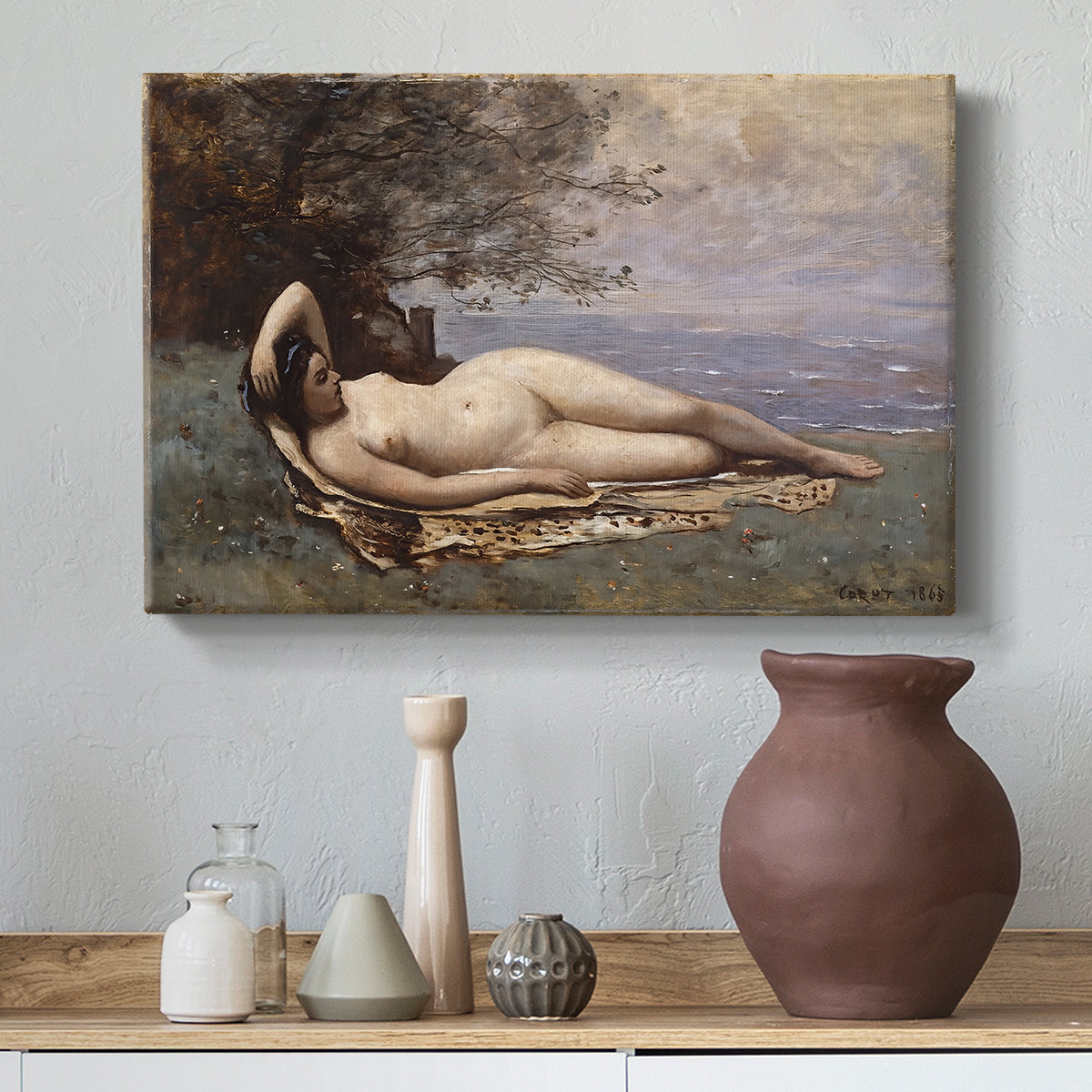 Canvas art print featuring a soft landscape with figure and sea in background, styled above a decorative console