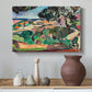 Canvas art print featuring an expressive landscape of colorful terrain and vegetation, styled above a decorative console