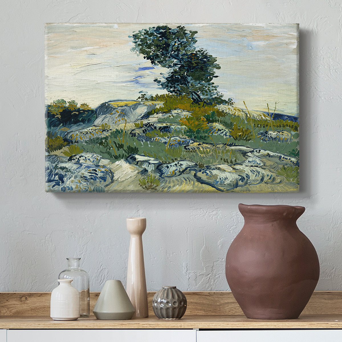 Canvas art print featuring a post-impressionist scene with rugged ground and minimal vegetation, styled above a decorative console