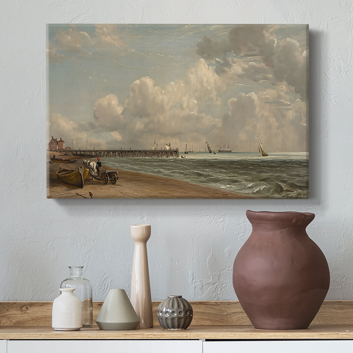 Canvas art print featuring a seaside composition with jetty, styled above a decorative console