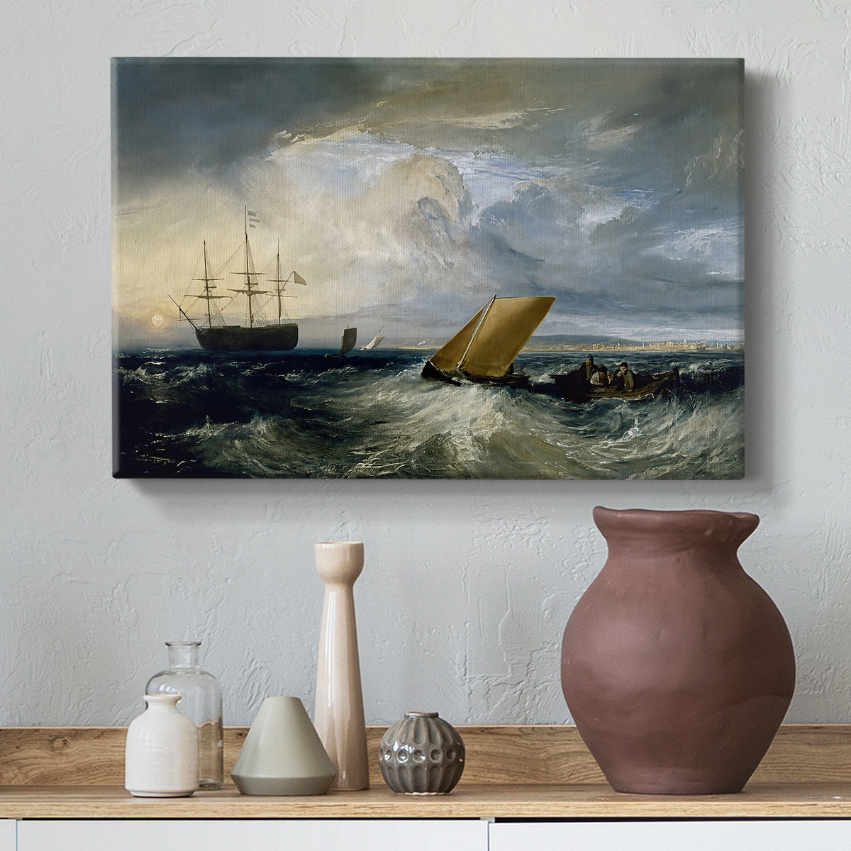 Canvas art print featuring an atmospheric seascape, styled above a decorative console