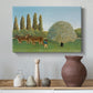 Canvas art print featuring a naïve landscape with animals and rolling greenery, styled above a decorative console