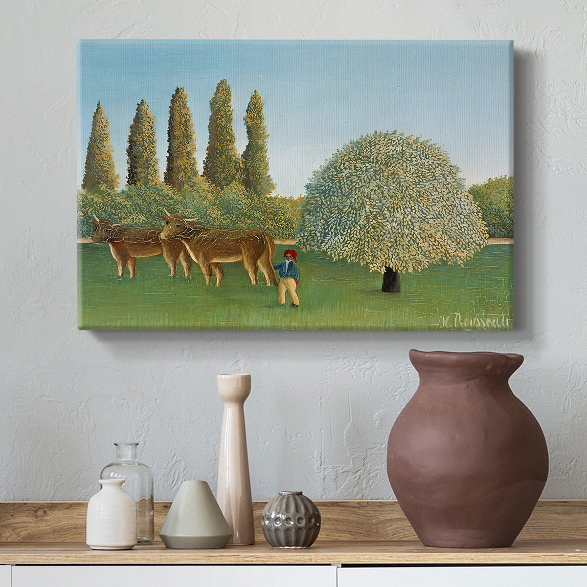 Canvas art print featuring a naïve landscape with animals and rolling greenery, styled above a decorative console