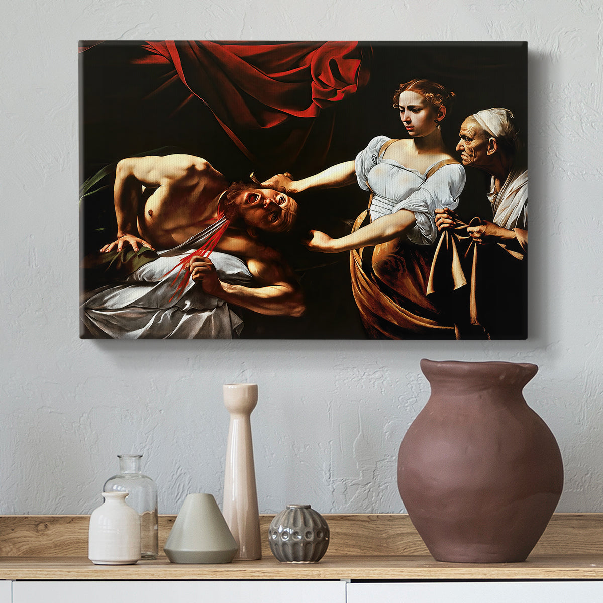 Canvas art print featuring an intense moment of Judith slaying Holofernes with sword, styled above a decorative console