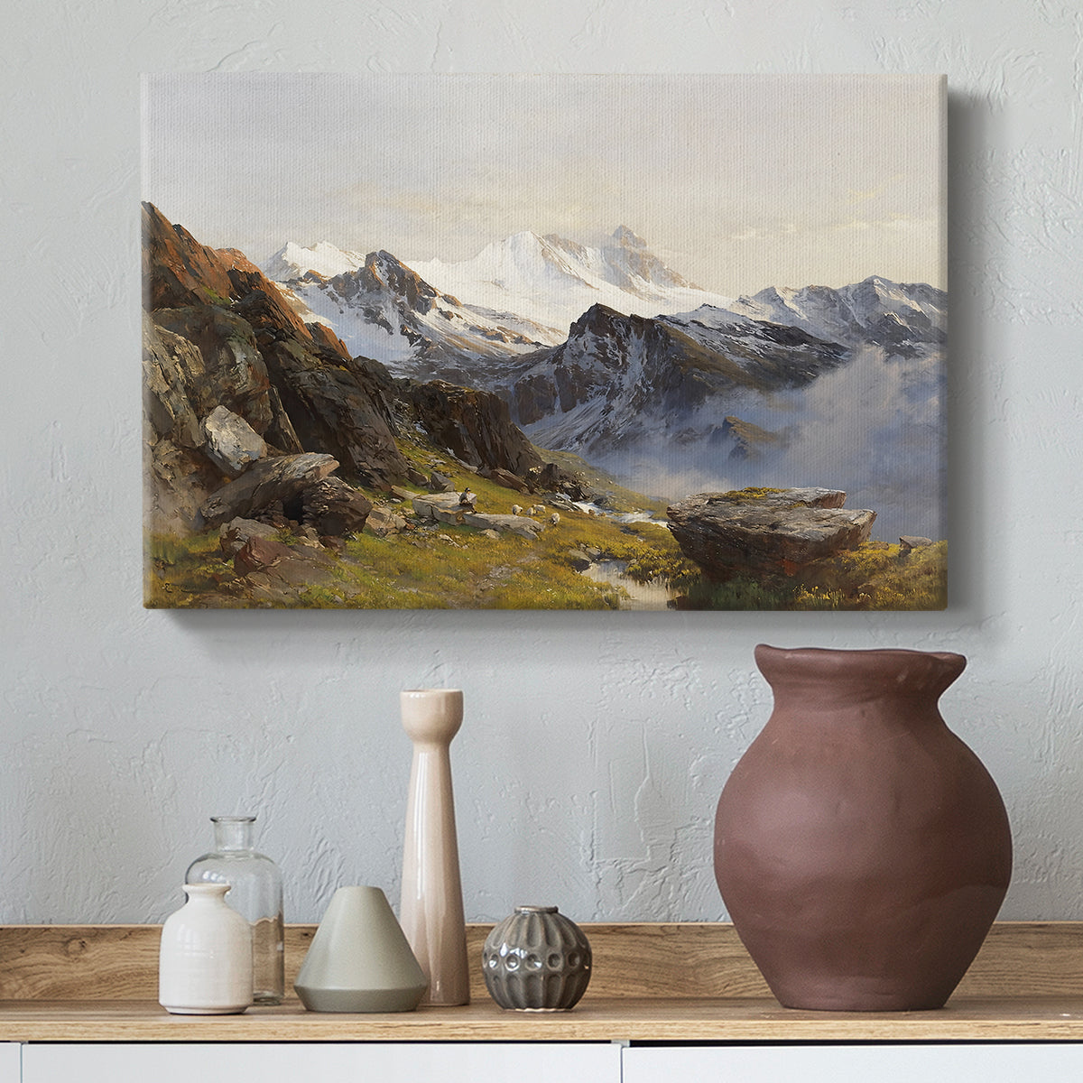 Canvas art print featuring an alpine vista with towering peak and foreground terrain, styled above a decorative console