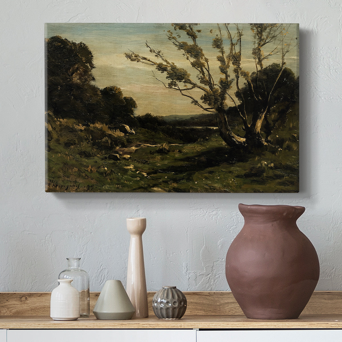 Canvas art print featuring a French countryside at dawn with trees and open terrain, styled above a decorative console
