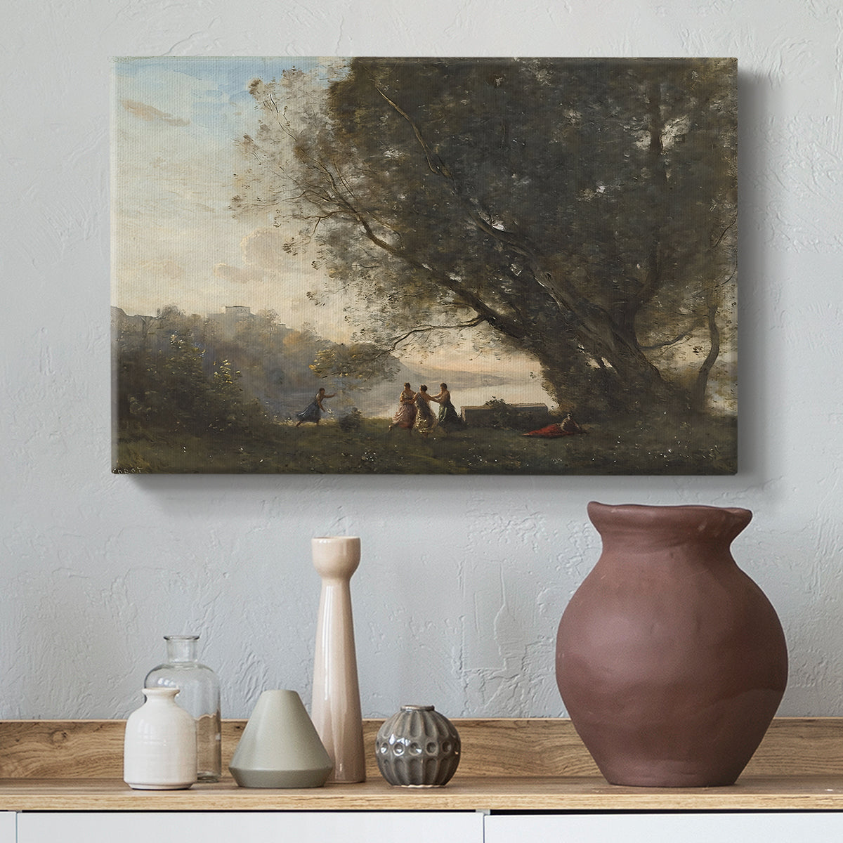 Canvas art print featuring a soft landscape combining figures and natural surroundings, styled above a decorative console