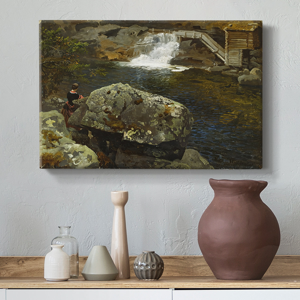 Canvas art print featuring a countryside pond with foliage and reflective surface, styled above a decorative console