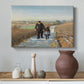 Canvas art print featuring an emotional depiction of two figures walking in open terrain, styled above a decorative console