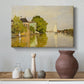 Canvas art print featuring an impressionist landscape with buildings along quiet canal, styled above a decorative console