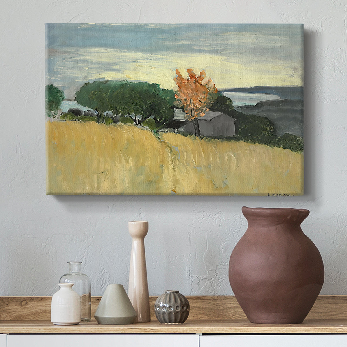 Canvas art print featuring a bright countryside scene with field and soft sky, styled above a decorative console