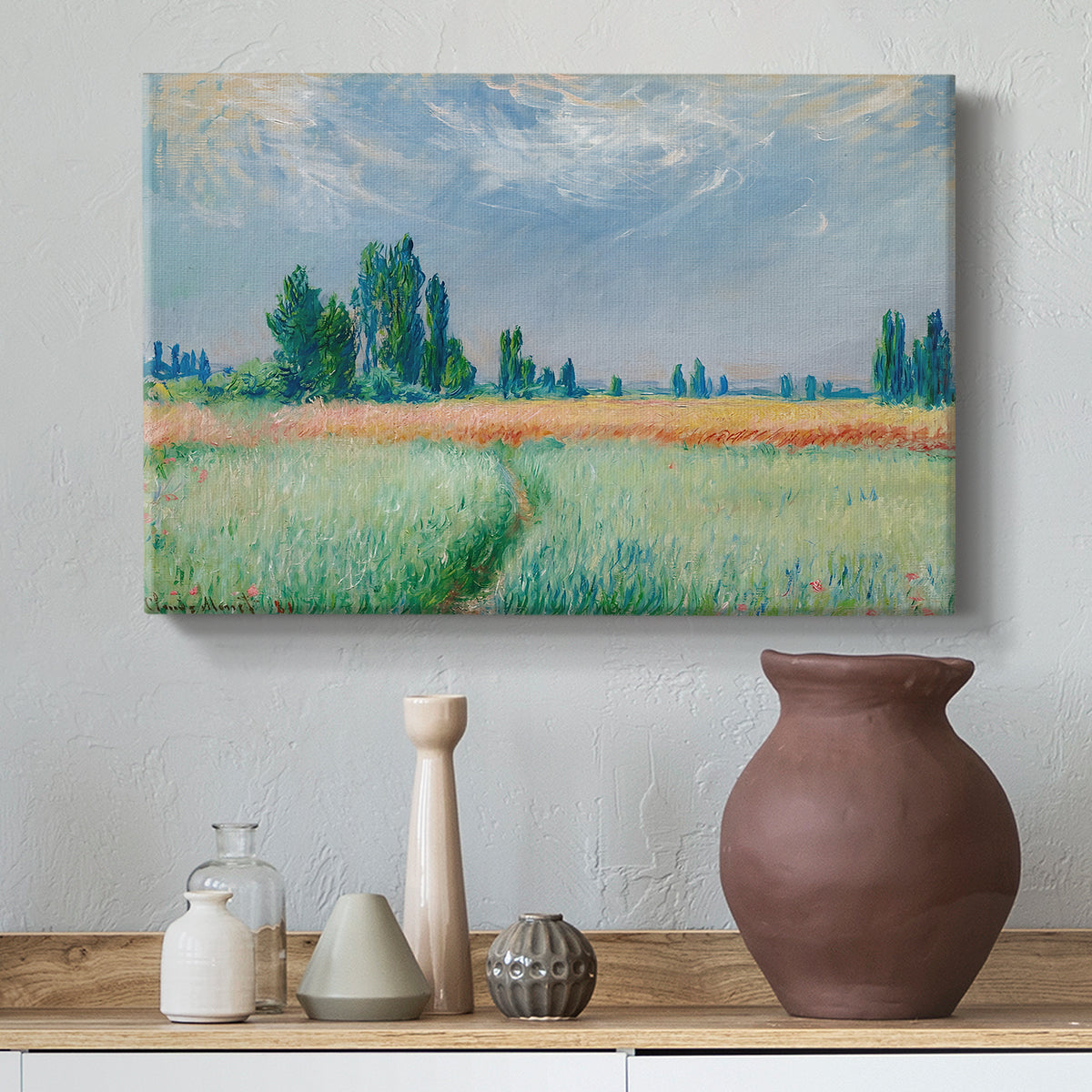 Canvas art print featuring an agricultural landscape with tall wheat and distant horizon, styled above a decorative console