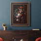 Classical floral still life painting by Jan van Huysum in an ornate bronzed mahogany wood frame displayed in a dark-toned interior setting.