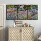 Three-panel canvas wall art featuring blooming irises in garden bed, displayed above a cabinet in an entryway.