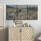 Three-panel canvas wall art featuring western wildlife grazing in open field, displayed above a cabinet in an entryway.