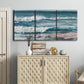 Three-panel canvas wall art featuring crashing ocean waves along shoreline, displayed above a cabinet in an entryway.