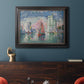 Impressionist harbor scene by Paul Signac in an ornate black frame with gilded inner detail displayed in a dark-toned interior setting.