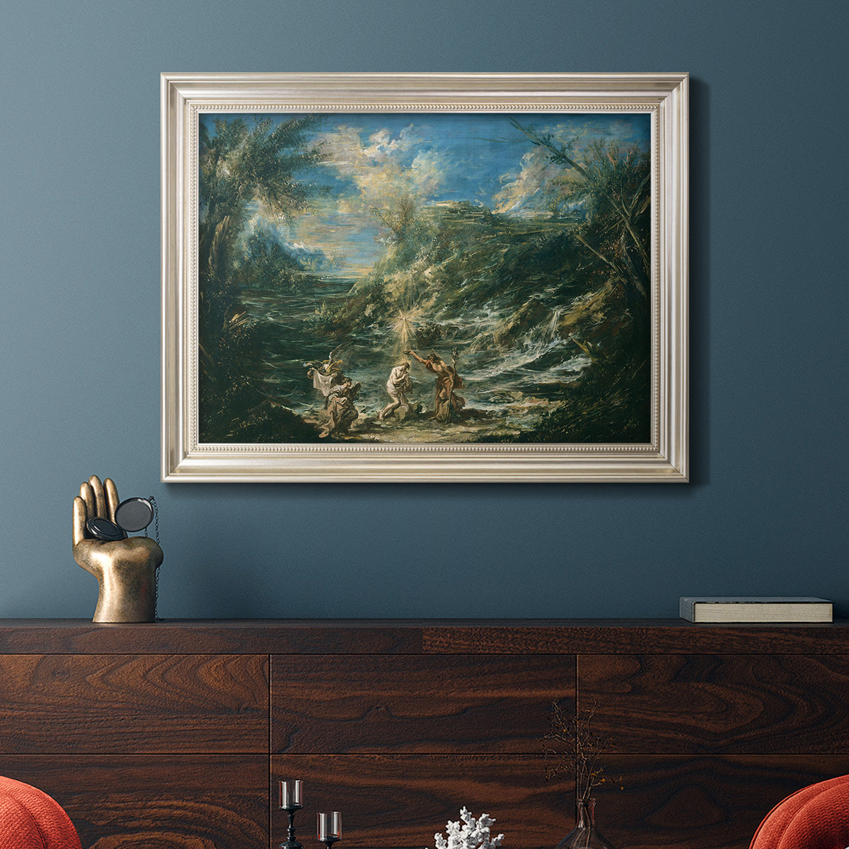 Religious landscape depicting the baptism of Christ by Alessandro Magnasco in an ornate champagne frame displayed in a dark-toned interior setting.