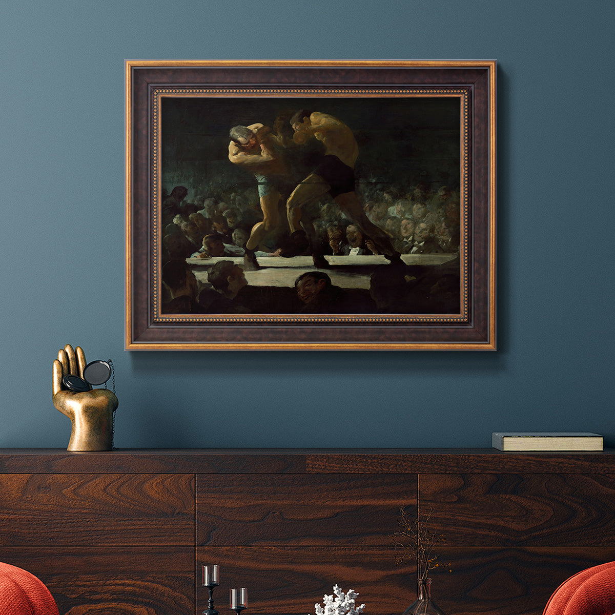 American social club scene painting by George Bellows in an ornate bronzed mahogany wood frame displayed in a dark-toned interior setting.