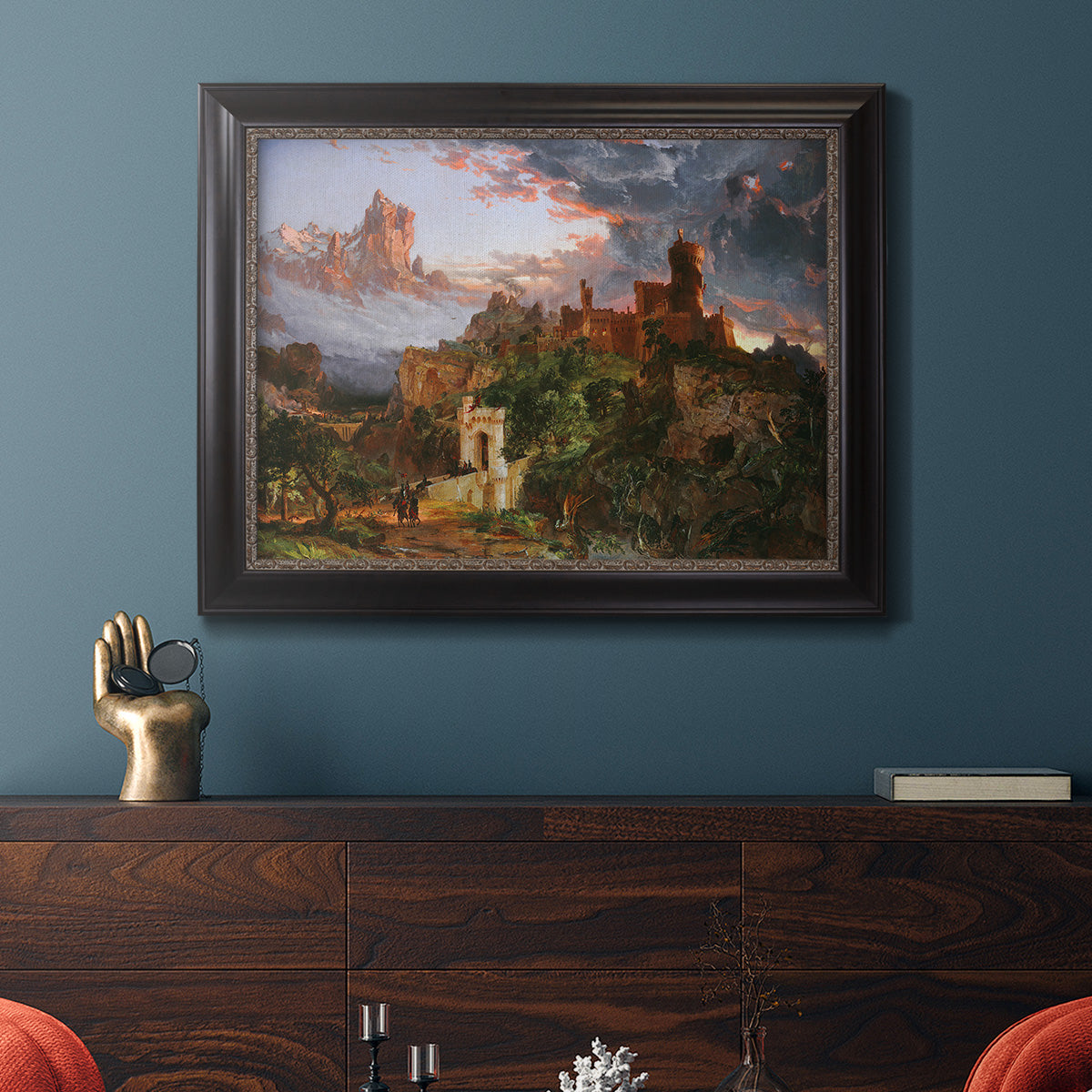 Romantic allegorical landscape painting by Jasper Francis Cropsey in an ornate black frame with gilded inner detail displayed in a dark-toned interior setting.
