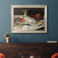 Impressionist still life painting of fish by Édouard Manet in an ornate champagne frame displayed in a dark-toned interior setting.