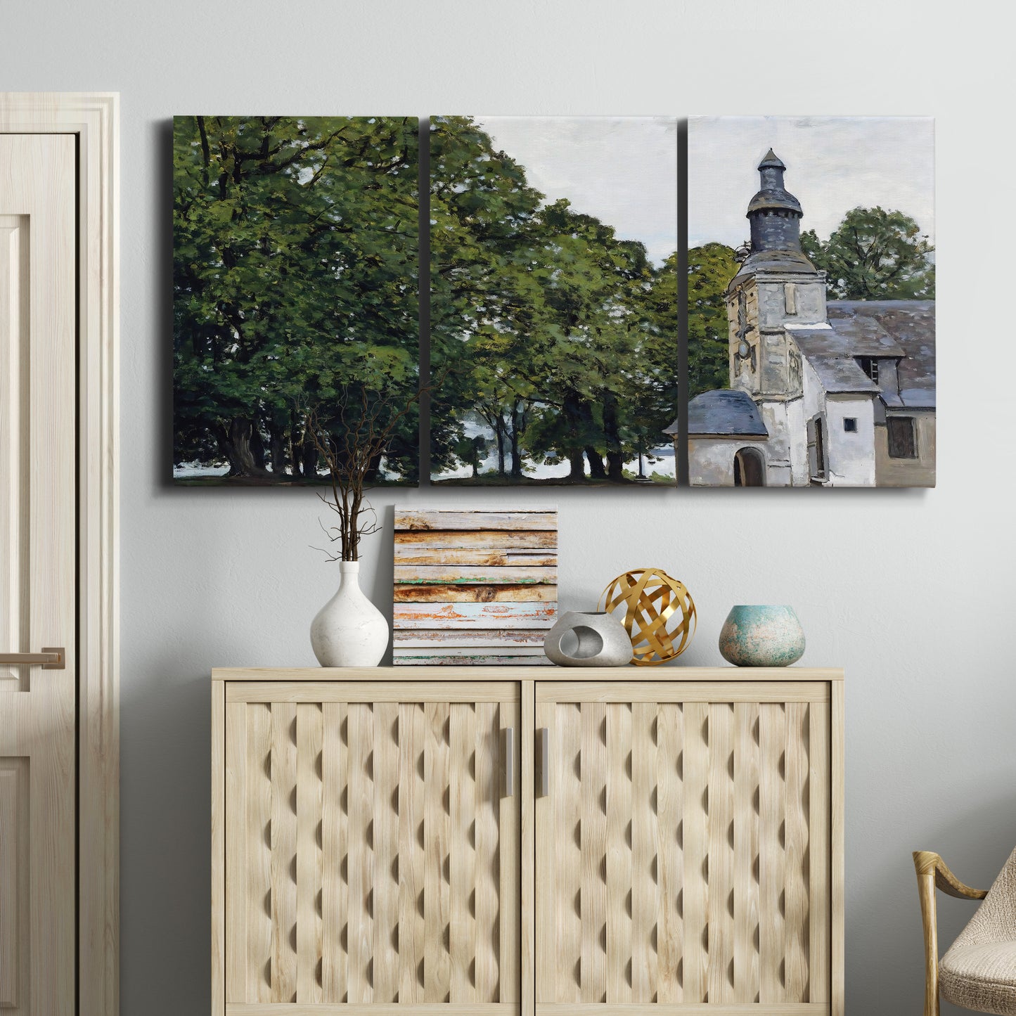 Three-panel canvas wall art featuring chapel building in rural setting, displayed above a cabinet in an entryway.