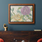 Contemporary peony flower illustration in an ornate vintage burl wood frame displayed in a dark-toned interior setting.