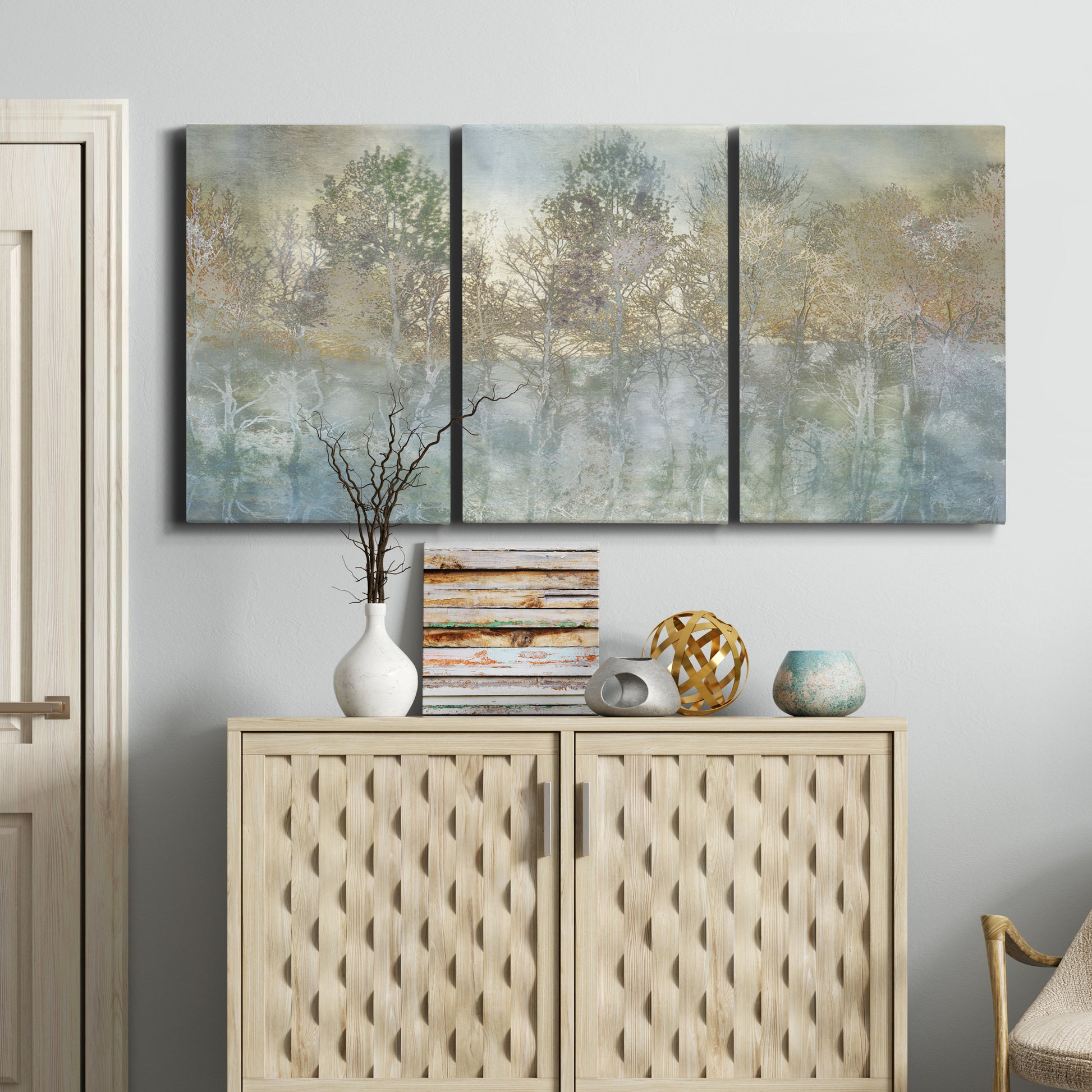 Three-panel canvas wall art featuring abstract river reflections, displayed above a cabinet in an entryway.