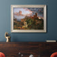 Romantic allegorical landscape painting by Jasper Francis Cropsey in an ornate champagne frame displayed in a dark-toned interior setting.