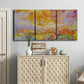 Three-panel canvas wall art featuring abstract meadow inspired color fields, displayed above a cabinet in an entryway.