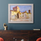 Impressionist Italian village scene by John Singer Sargent in an ornate weathered white frame displayed in a dark-toned interior setting.