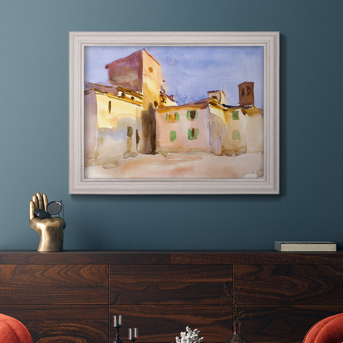 Impressionist Italian village scene by John Singer Sargent in an ornate weathered white frame displayed in a dark-toned interior setting.