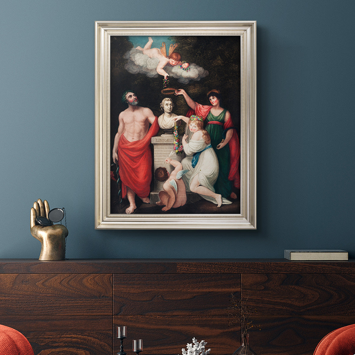 Classical allegorical painting honoring Linnaeus by Robert John Thornton in an ornate champagne frame displayed in a dark-toned interior setting.