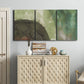 Three-panel canvas wall art featuring layered green abstract composition, displayed above a cabinet in an entryway.