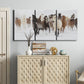 Three-panel canvas wall art featuring horses running across snowy pasture, displayed above a cabinet in an entryway.